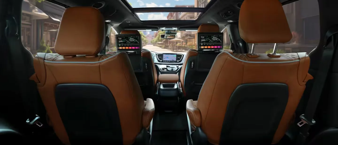 2026 Chrysler Pacifica tan cabin with dual rear entertainment screens and panoramic roof